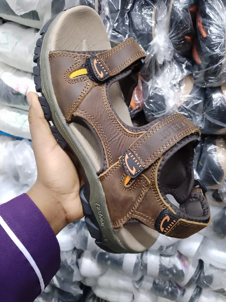 brown_leather_sandals_with_orange_accents_2.webp