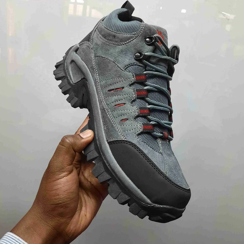 gray_waterproof_hiking_boots_with_orange_accents,_rugged_tread,_and_breathable_2.webp