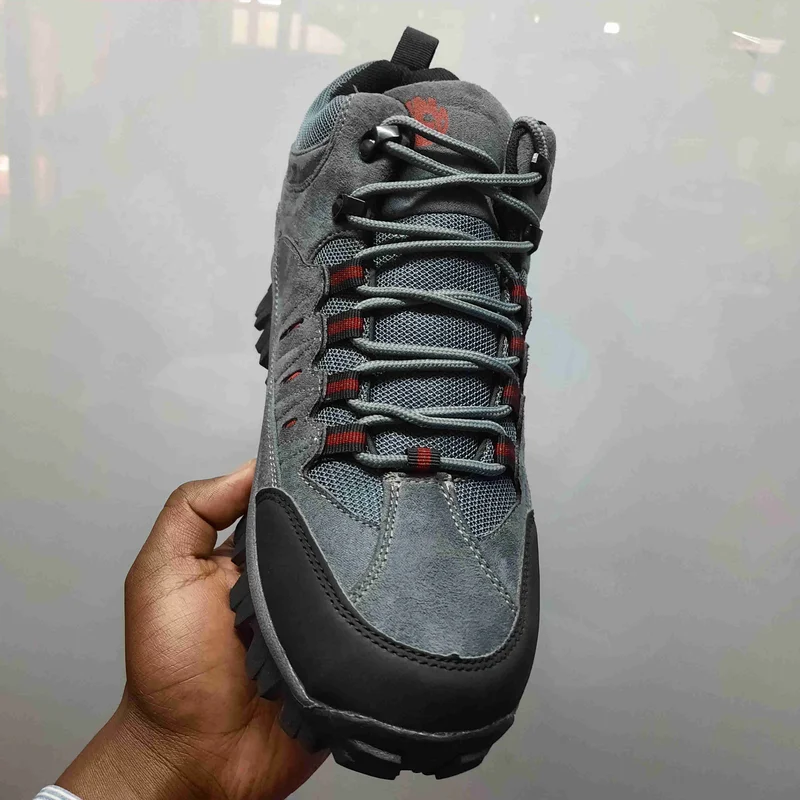 gray_waterproof_hiking_boots_with_orange_accents,_rugged_tread,_and_breathable_3.webp