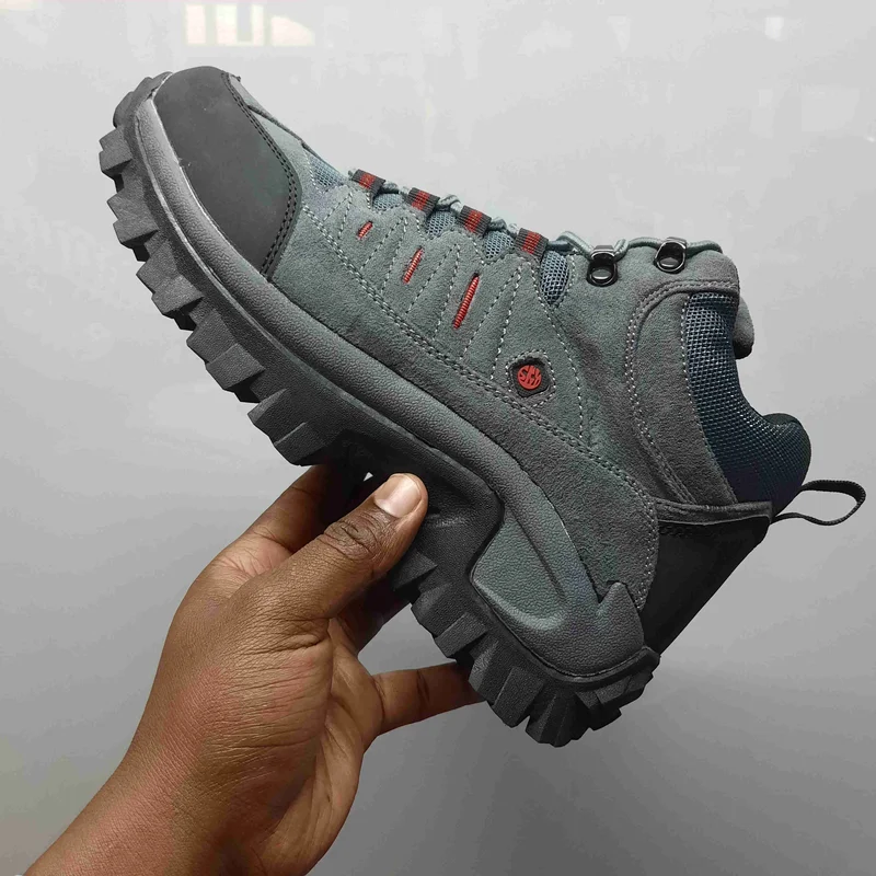 gray_waterproof_hiking_boots_with_orange_accents,_rugged_tread,_and_breathable_4.webp