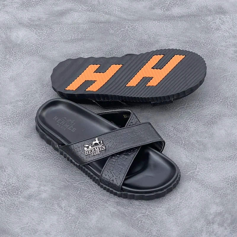 hermès_slide_sandals_-_black_with_orange_accents_2.webp