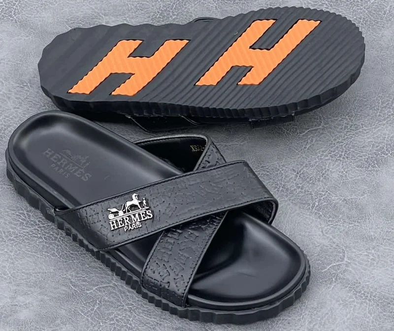 hermès_slide_sandals_-_black_with_orange_accents_4.webp