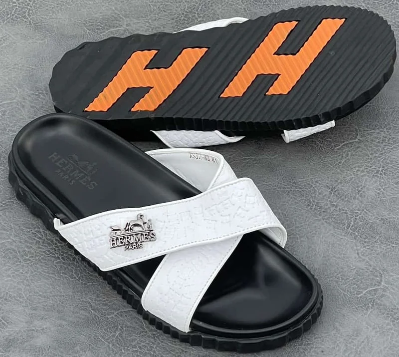hermès_slide_sandals_–_white_black_with_orange_accents_2.webp