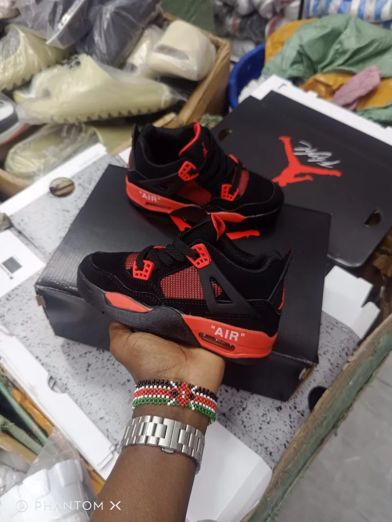 kids_air_jordan_4_red_thunder_sneakers_2.webp