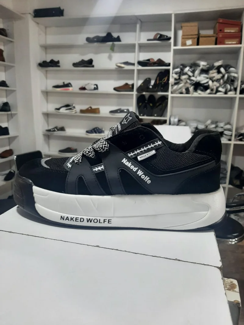 black_and_white_quality_original_naked_wolfe_unisex_sneakers_3.webp
