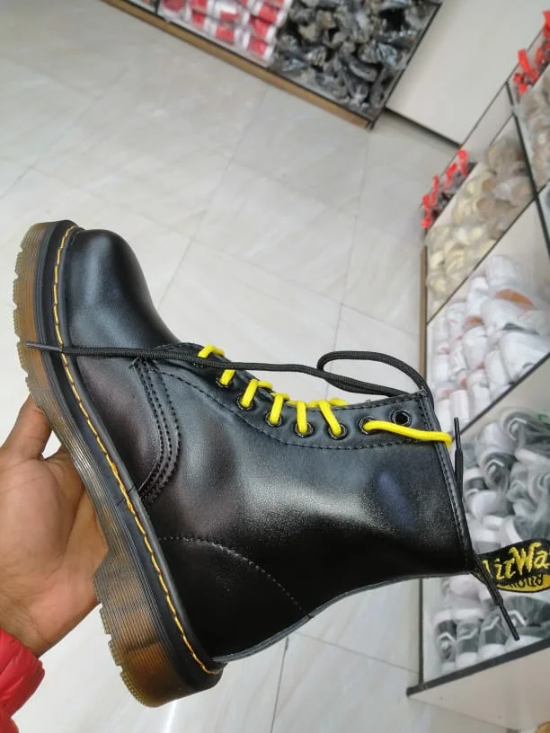 black_yellow_laces_ankle_platform_dr_martin_boots_women_chunky_2.webp