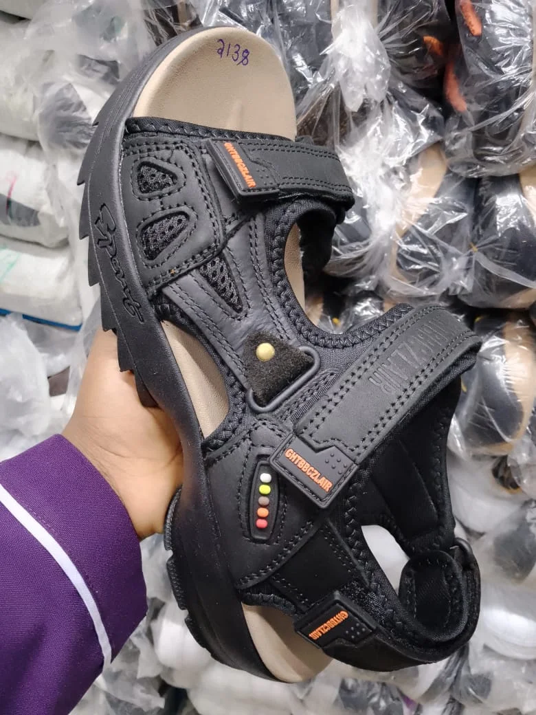 BLACK LEATHER SANDALS WITH ORANGE ACCENTS